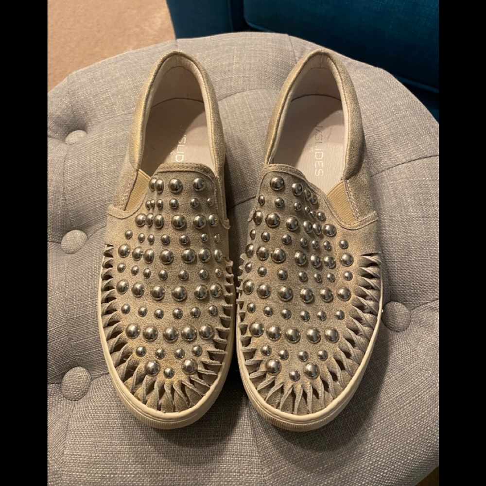 Silver studded sneakers.